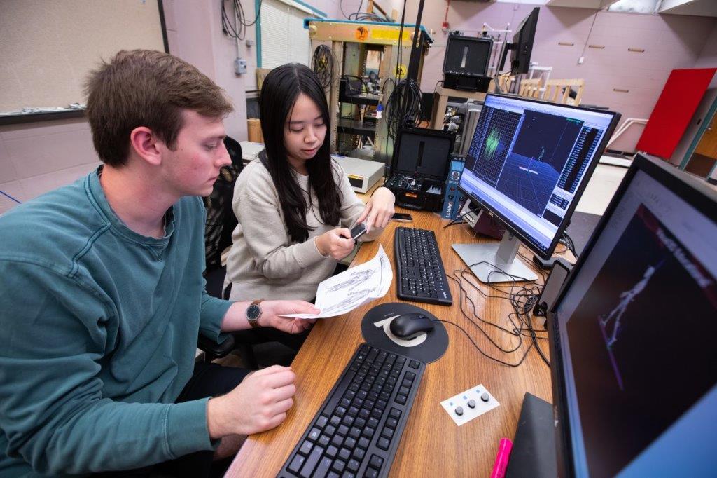 Man and woman working at computer